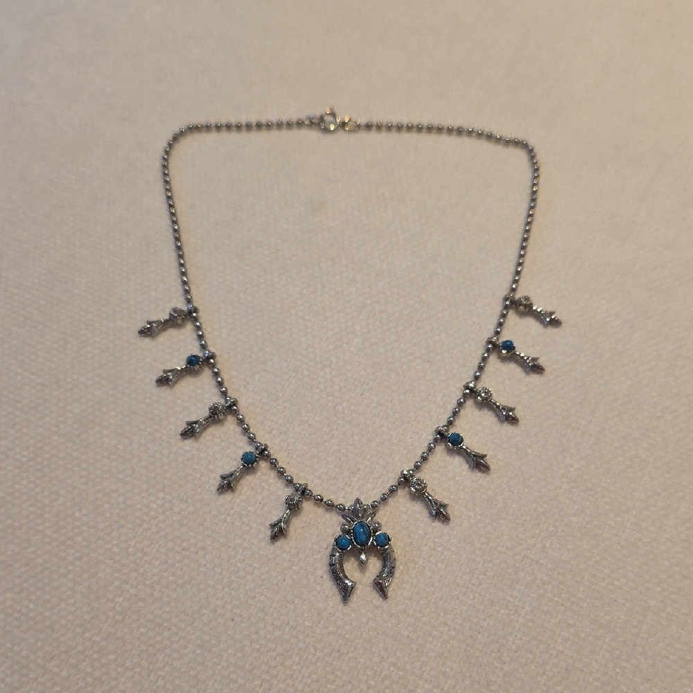 Silver Horseshoe Pendant Necklace with Turquoise Blue Accents